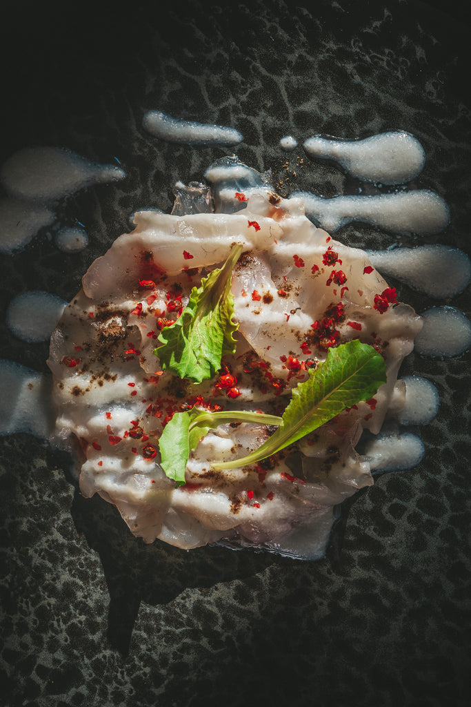 Sea Bass Carpaccio with Buffalo Cream, Pink Pepper, and Truffle Zest