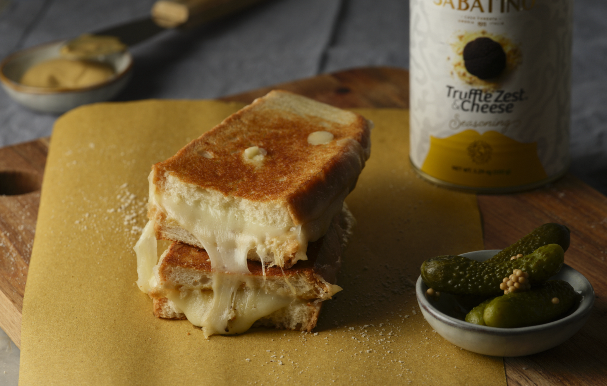 a grilled cheese sandwich on a cutting board