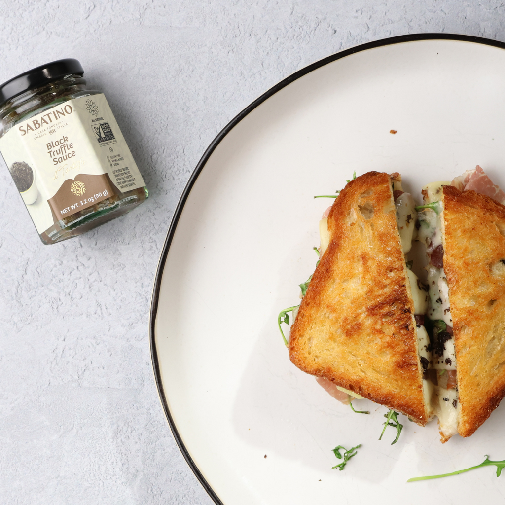 Grilled Cheese with Black Truffle Sauce, Prosciutto, and Arugula – Sabatino