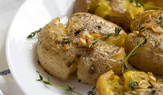 Crispy Smashed Potatoes with
Truffle & Smoked Sea Salt