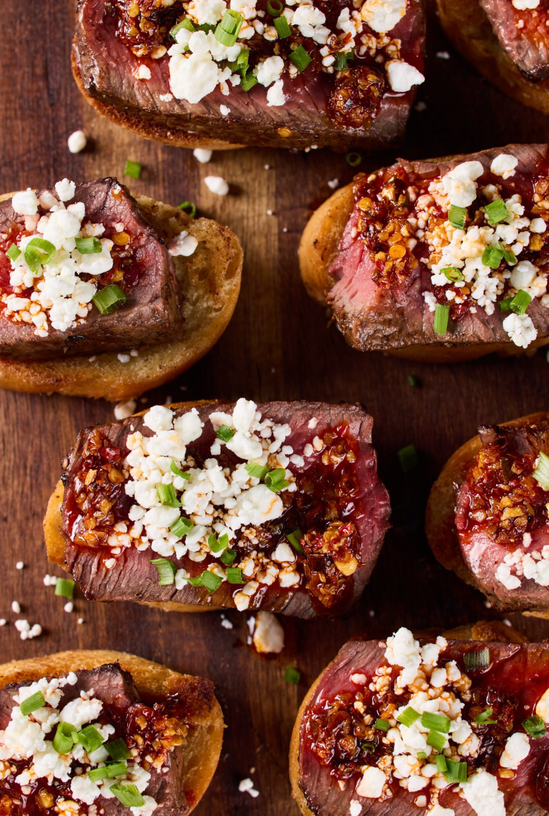 a group of meat and cheese on toast